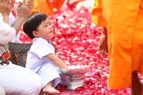 child at buddhist festival