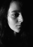 face of schoolgirl in the shadows