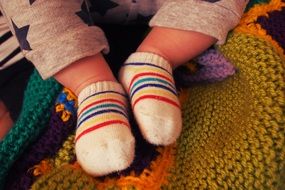 baby feet in striped socks