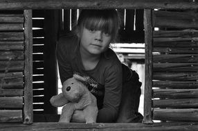 child with soft toy