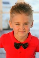 Portrait of stylish boy in a red shirt