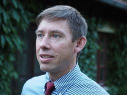 portrait of a man in a shirt and tie