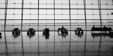 black and white photo of the airport lounge