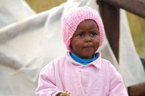 african child in pink clothes