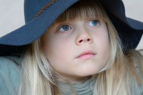 Blue eyes girl blond face hat look