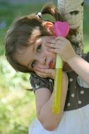 cute little girl near a tree
