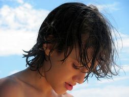 photo of a brazilian teenager against a blue sky