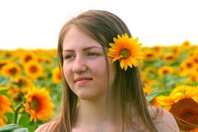 portrait of a girl among sunflowers