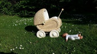 doll and baby carriage outdoors