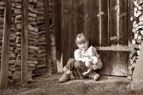 Little girl with teddy bear ground sit wooden wall