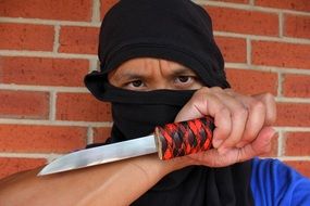 ninja in mask and with a knife