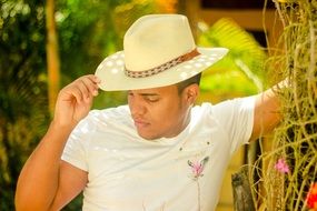 cool young man in white hat