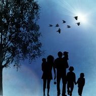 family silhouette on a blue sky background
