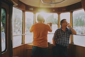 men in the cabin on the cable car