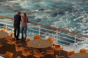 pair standing on a cruise ship