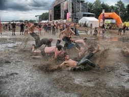 young men in the rain puddle