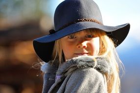 child girl blond hair cute face hat
