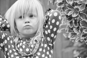 offended little girl in black and white image