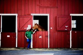 cowboy and horse in stall