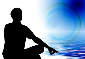silhouette of a meditator