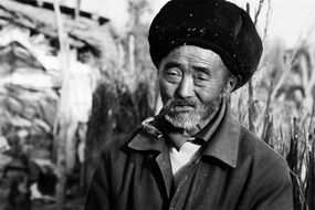 black and white portrait of an elderly man in china