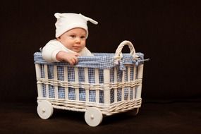 small baby boy in the basket