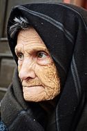 old woman in a black scarf