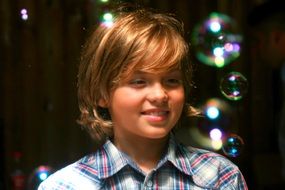boy playing soap bubbles