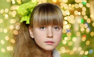 child girl blond long hair magic light background