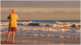 Man is standing on the beach in Spain