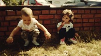 children play on the grass