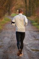 jogger in park, back view