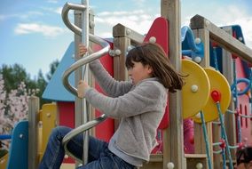 climbing girl on the playground