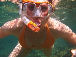 diver, young girl in diving mask under water