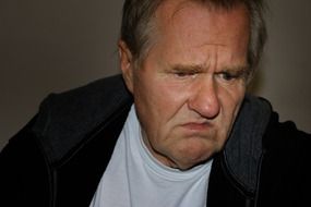 man with a disappointed face expression