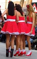 young girls in red dresses outdoor, spain, catalonia