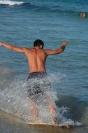 Photo of Man skim boarding