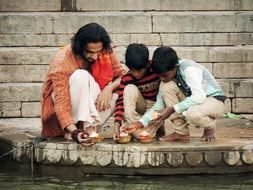 boys pray with dad