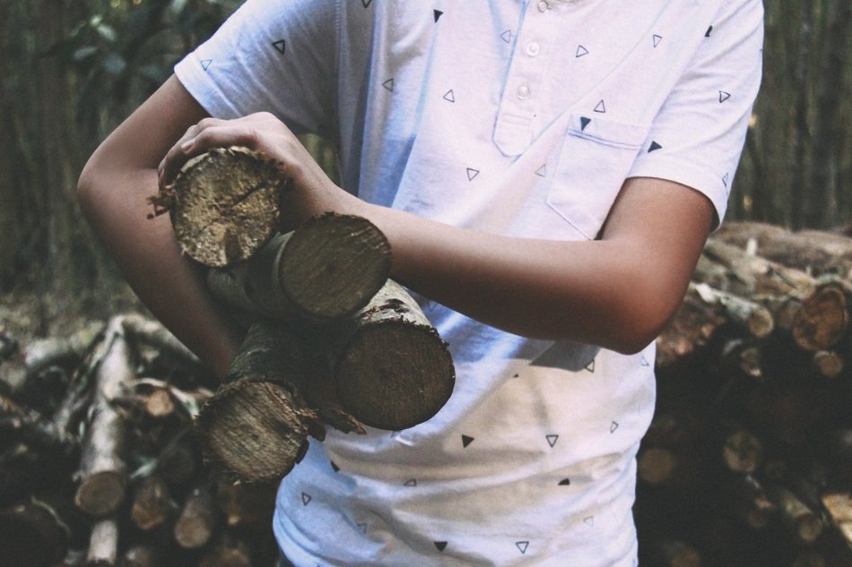 boy carrying firewood