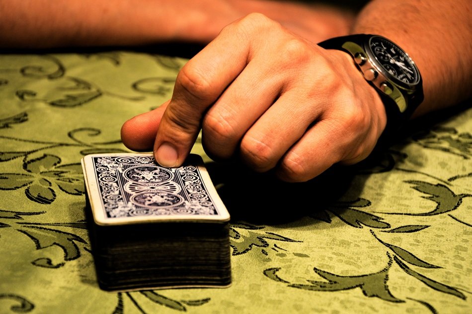 watches on hand plaing cards