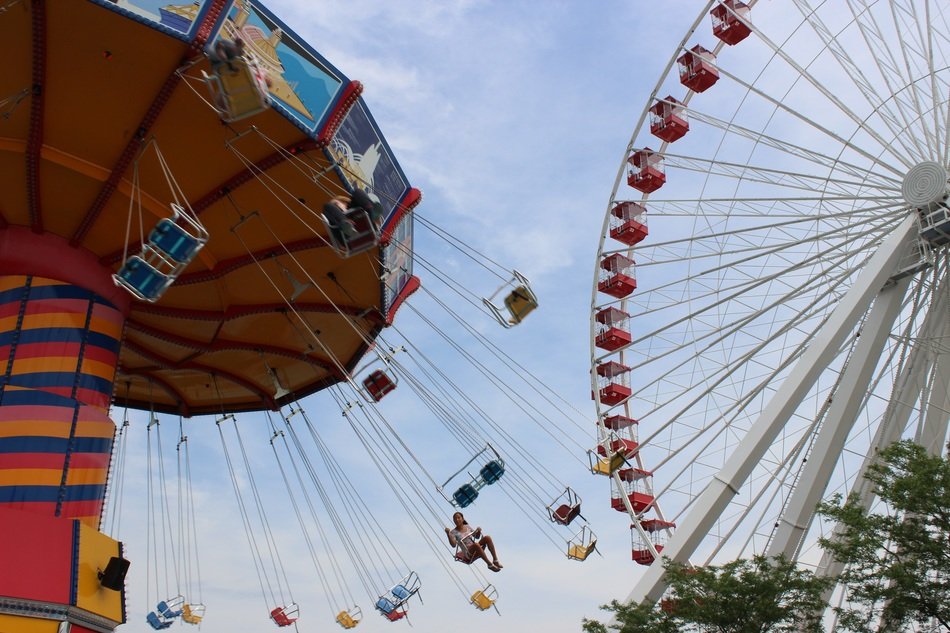 people ride on an entertainment attraction