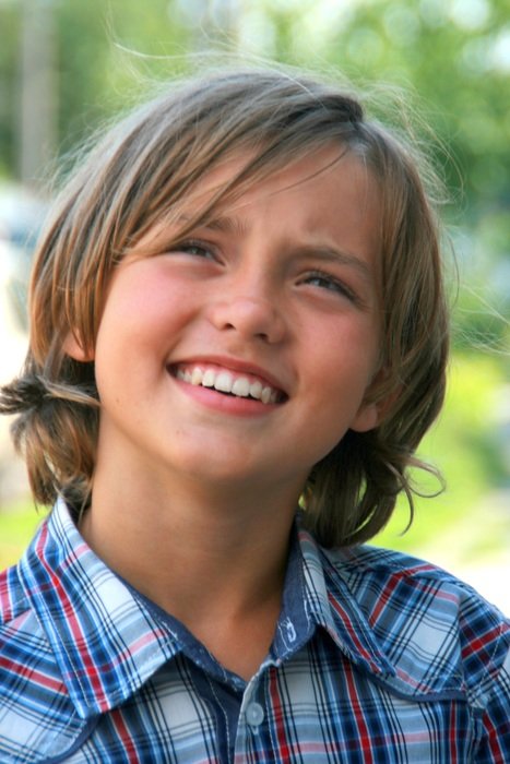 Portrait of a beautiful boy with an innocent expression on his face