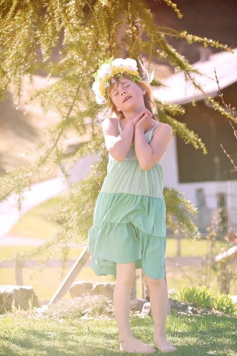 Dreamy girl with crown of flowers