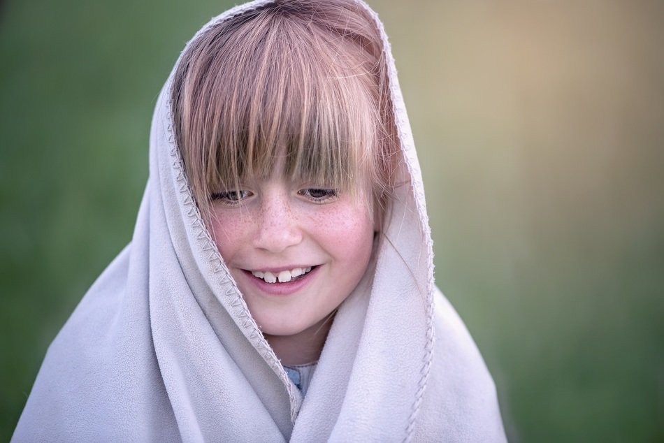 girl wrapped up in the blanket