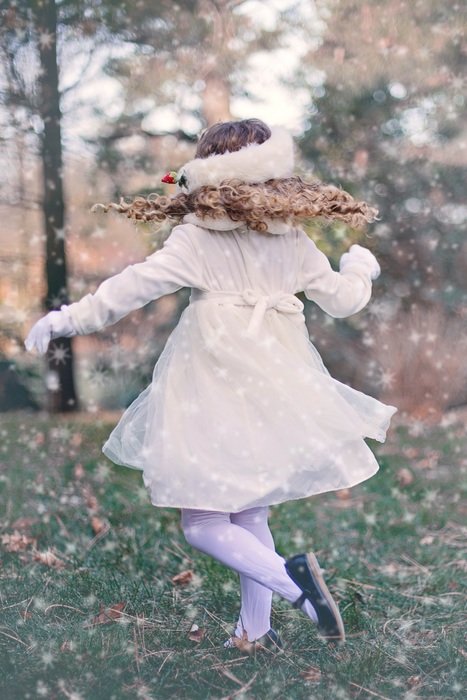 girl spinning on the grass
