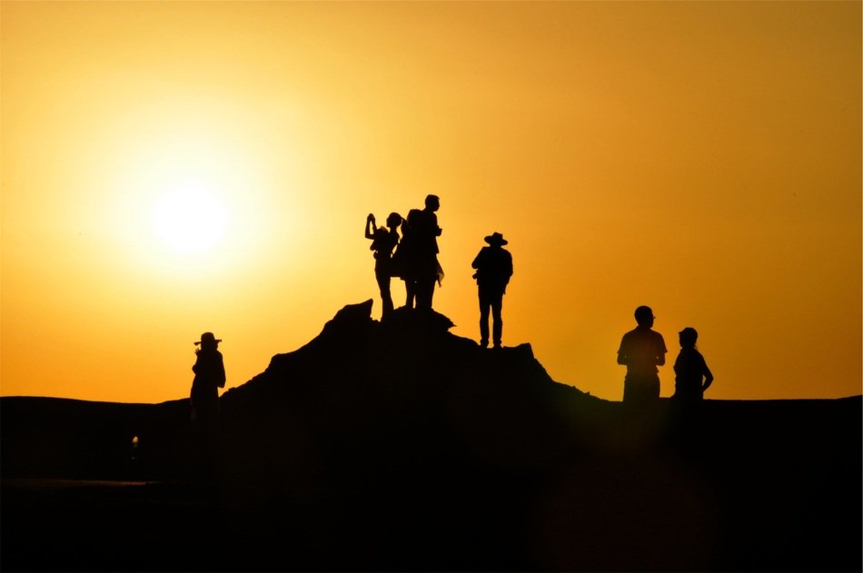 Silhouettes of people at the sunset