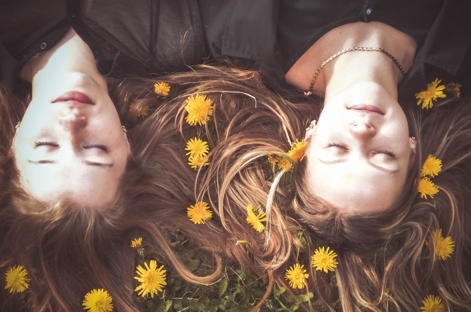 Girls in the spring with dandelions in the hair