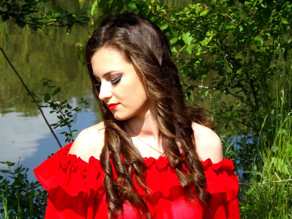 dreamy girl on the background of the lake
