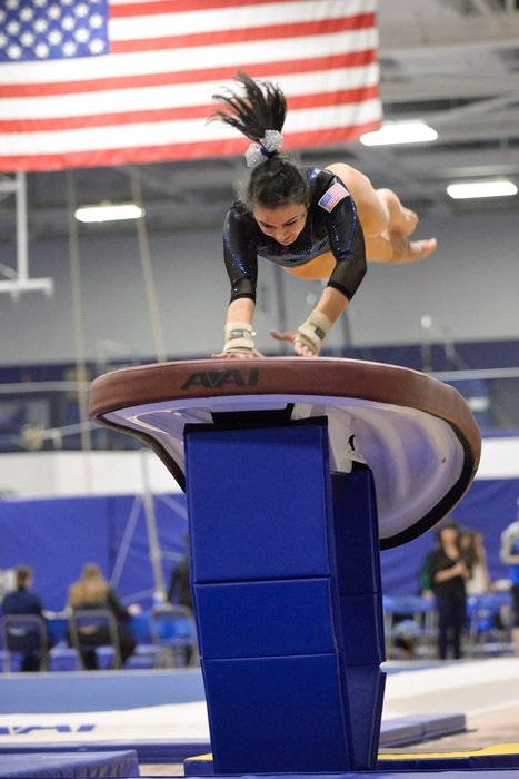 gymnast performs an exercise in competition