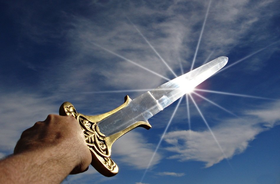 reflection of the sun from the blade of a sword